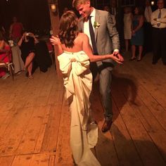 a bride and groom dancing on the dance floor