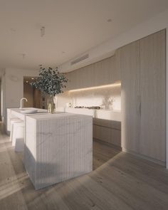 a large kitchen with an island and white counter tops in the middle of the room