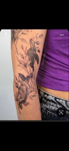 a woman with a tattoo on her arm