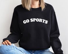 Go Sports Sweatshirt, Go Sports Team Sweatshirt, Funny Sports Sweatshirt, Football Tee, Ladies Sport Sweatshirts, Sports Mom Sweatshirt Thank you so much for choosing us! How To Order 1️⃣ Please review all the information provided before placing an order. 2️⃣ Select the sweatshirt type and size using the drop down menu. 3️⃣ Select the color of the shirt using the following drop down menu. 4️⃣ Once all your desired items are in your cart you may complete your order by entering your payment method Cheap Logo Print Sweatshirt For Sports, Black Sports Fan Sweatshirt For Sports Season, Collegiate Crew Neck Hoodie For Sports, Black Sports Fan Sweatshirt, Varsity Long Sleeve Sports T-shirt, Crew Neck Hoodie For Sports Events, Sporty Sweatshirt For Sports Season, Collegiate Sports Sweatshirt With Team Name, Varsity Crew Neck Sports Hoodie