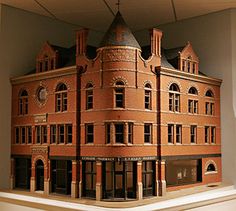 a model of a brick building on display