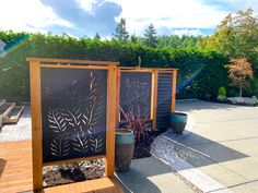 an outdoor area with wooden benches and planters