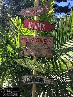 there are many signs on the pole that say welcome to mason's 1st birthday