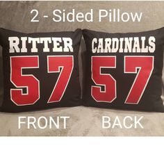 two pillow cases with the same name and number on them, one is black and the other is red