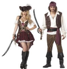 two people dressed up in pirate costumes and holding swords, standing next to each other