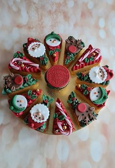 a christmas cookie decorated with santa claus and other holiday treats