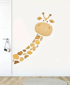 a giraffe's head is painted on the wall