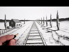 someone is drawing a train track with pencils