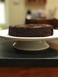 a chocolate cake sitting on top of a white plate