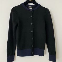 100% Authentic Chanel Uniform Cardigan Size Xs Black/Navy Good Condition Luxury Black Sweater With Button Closure, Designer Black Cardigan With Button Closure, Luxury Black Cardigan With Button Closure, Luxury Black Cardigan For Formal Occasions, Luxury Black Formal Cardigan, Designer Fitted Black Cardigan, Designer Black Workwear Sweater, Luxury Black Fitted Cardigan, Black Fitted Luxury Cardigan