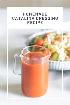 homemade catalina dressing recipe in a glass pitcher next to a bowl of salad