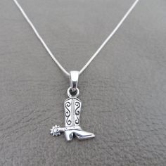 "A sweet and simple necklace with a Cowboy Boot Pendant. The pendant is made of sterling silver as well as the chain. The pendant on the necklace measures about 20mm x 10mm with bail. The chain measures 18\". Your necklace will be shipped in a gift box." Cowboy Boot Pendant, Cowboy Boot Jewelry, Cowboy Necklace, Pretty Silver Jewelry, Cowboy Boot Necklace, Western Pendant, Silver Cowgirl, Cowgirl Necklace, Nail Cross Necklace