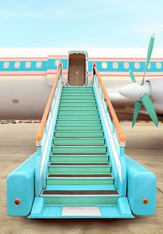 an airplane with stairs going up to the door