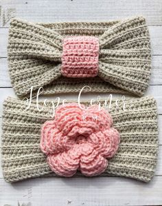 two crocheted headbands with pink flowers on them