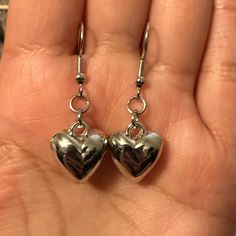 Cute Small Heart Shaped Silver Tone Hook Pierced Earrings *Brand New. *Silver Tone. *Material: Zinc Alloy. *Stainless Steel Hooks. *Size: 1.5 Inches Approximately. *Style: Coquette, Romantic, Glam, Retro. *Occasion: Casual, Going Out, Party, School, Work, Summer, Vacation, Outdoors, Etc. #Earrings #Heart #Silvertone #Gift#Valentines-Day Silver Dangle Heart Earrings For Party, Party Silver Heart Earrings With Beads, Metal Heart Beads Earrings For Gifts, Metal Heart Beaded Earrings For Gifts, Heart Beads Metal Earrings For Gift, Silver Dangle Heart Earrings For Everyday, Gift Metal Heart Earrings With Heart Beads, Silver Open Heart Earrings For Party, Everyday Silver Heart Pendant Earrings