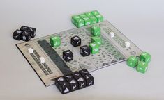 a board game with dices and pieces on it