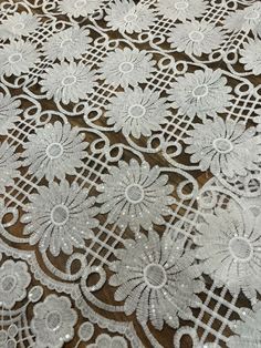 white lace with flowers on brown background