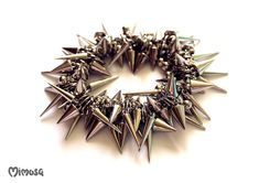 "Gothic Bracelet, Punk Spike Bracelet, Silver Spike Bracelet, Punk Rock Bracelet, Gothic Jewelry, Stud Punk Rock Bracelet, Goth Stud Bracelet, Thorn Bracelet, Unisex Punk Bracelet, Unisex Gothic Jewelry Chunky punk rock bracelet made of plastic silver spikes and beads. The beads are strung on elastic silicone cord.  Choose your wrist size with the drop-down menu. 5.5\" - 14 cm. 6\" - 15.2 cm. 6.5\" - 16.5 cm. 7\" - 17.8 cm. 7.5\" - 19.1 cm. 8\" - 20.3 cm. 8.5\" - 21.6 cm. 9\" - 22.9 cm. ♥ Unique Rock Style Metal Bracelets With Studs, Metal Rocker Style Bracelet For Festivals, Rock Style Spiked Jewelry For Parties, Rock Style Spiked Party Jewelry, Silver Rocker Jewelry With Studs, Rock Style Party Jewelry With Spikes, Silver Rocker Jewelry With Spikes, Silver Rock Style Jewelry For Party, Silver Studs Jewelry For Party