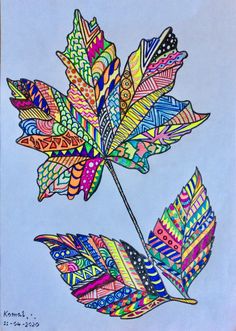 a drawing of a colorful leaf on a blue background