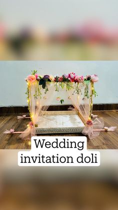 an image of a bed with flowers on it and the words wedding invitation doll above it