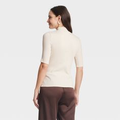 Take your casual looks to the next level with this Ribbed Short-Sleeve Mock Turtleneck T-Shirt from A New Day™. The short-sleeve tee is cut from midweight fabric with added spandex for comfortable wear from day to night and season to season, while the 2 x 2 rib-knit construction adds a touch of texture. Tailored in a flattering fitted silhouette, the short-sleeve tee with a mock turtleneck is easy to dress up or down for a variety of occasions. A New Day™: Style that goes wherever you do. Turtleneck T Shirt, Ribbed Shorts, Mock Turtleneck, Slim Fit Shorts, Hem Style, Fitted Silhouette, A New Day, Fashion Tees, Next Level