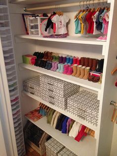 the closet is full of baby shoes and other items for sale on shelves with bins to store them