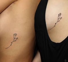 two women with tattoos on their stomachs and one has a flower tattoo on her left side