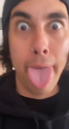 a man making a funny face with his tongue out