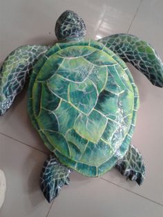 a green sea turtle painted on the floor