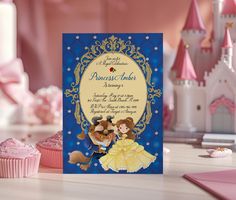 there is a card with an image of princess and prince on it in front of cupcakes