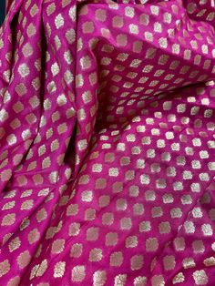 Pink Handloom Banarasi Silk Saree with Grand Pallu. SmalButtis all over the body of the Saree with Grand Pallu. Item : Saree Color : Pink Base Fabric : Banarasi Silk Blouse piece : Comes with Blouse piece Blouse material : Banarasi Silk Fall & Edging: Comes with Fall and edging (Pico) and tassels attached Occasion: Party, Wedding, Festival, Wedding, Traditional, Religious, House-warming, Social Gatherings and Celebrations. Please note- Color might slightly vary due to lighting and camera. Ki Semi-stitched Gold Anarkali Set With Motifs, Festive Brocade Sharara With Zari Work, Festive Brocade Salwar Kameez With Zari Work, Festive Unstitched Banarasi Silk Choli, Unstitched Banarasi Silk Choli For Festive Occasions, Festive Gold Banarasi Silk Anarkali Set, Gold Banarasi Silk Anarkali Set For Festive Occasions, Gold Silk Sets With Motifs, Festive Gold Banarasi Silk Sharara