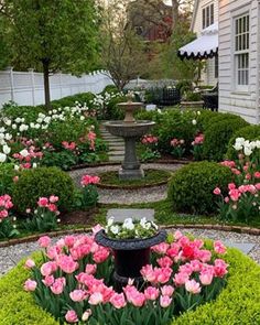 a garden filled with lots of pink and white flowers