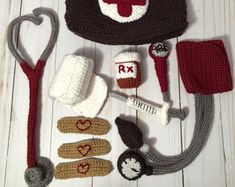 a crocheted hat, gloves and other items are laid out on the floor