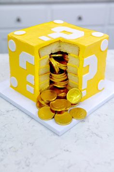 a cake made to look like a dice with coins in it