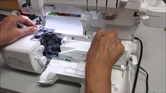 a man is working on a sewing machine