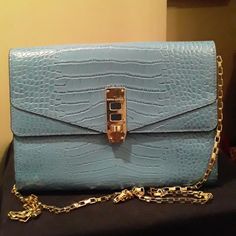 Women's Blue With Gold Tone Chain Strap Henri Bendel Envelop Purse Approximately 6.5"H9"W ** Pls See All Pics For Reference ** Minimal Signs Of Wear In Pre-Owned Condition Chic Light Blue Formal Bag, Elegant Light Blue Office Bag, Light Blue Rectangular Shoulder Bag For Formal Occasions, Light Blue Formal Crossbody Bag, Formal Light Blue Crossbody Bag, Elegant Light Blue Rectangular Shoulder Bag, Formal Light Blue Shoulder Bag, Blue Crossbody Clutch For Evening, Light Blue Formal Crossbody Shoulder Bag