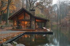 a small cabin sits on the edge of a lake