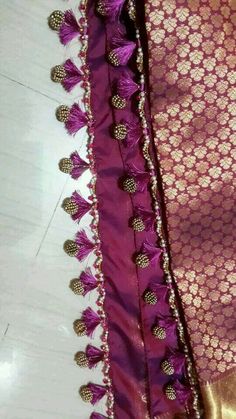 purple and gold sari with tassels