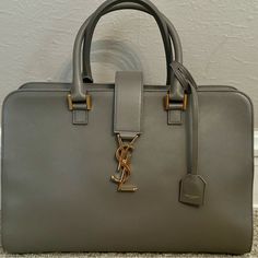 Excellent Condition Comes With Authenticity Card And Dust Bag. Crossbody Strap Included. Measurements: Height: 9 3/4" Width :14" Short Handle Drop Is About 5.5" Removable Long Strap 20" Drop These Are Approximate Measurements Please Note That This Is The Large Size Bag Ysl Cabas Bag, Bags Ysl, Ysl Saint Laurent, Saint Laurent Bags, Monogram Bag, Saint Laurent Bag, Crossbody Tote, Crossbody Strap, Womens Tote Bags