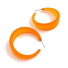 Orange hoop earrings made of vintage lucite in a frosted finish. The Emily Hoop is one of our most popular and largest styles. It's bold & lightweight, a great statement hoop earring.  Each measures 1.5" in diameter and about 1/2" at the widest. This style comes in lots of other luscious colors. Be sure to check out the rest of the earrings in the shop for other color options in this same style.Jewelry is designed & hand finished by us, here in the US. Most all are made with vintage lucite parts Statement Hoop Earrings, Surgical Steel Earrings, Upcycled Fashion, Velvet Matte, Vintage Lucite, Same Style, Earrings Vintage, Jewelry Earrings Hoops, Style Jewelry