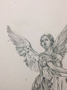 a drawing of an angel sitting on top of a table