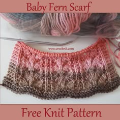 the knitting pattern for baby fern scarf is shown in pink, brown and white yarn