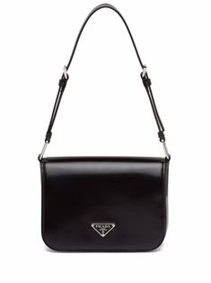 Black leather brushed leather shoulder bag from PRADA featuring brushed finish, enamel triangle logo, silver-tone hardware, front flap closure, magnetic fastening, internal slip pocket and adjustable shoulder strap. Triangle Logo, Black Shoulder Bag, Cute Bags, Black Bag, Wash Bags, Prada Bag, Kate Spade Crossbody, Luxury Bags, Leather Shoulder Bag