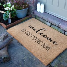 a welcome mat with the words we're going home on it in front of a house