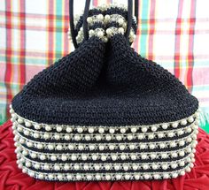 Items come from a smoke and pet Free Home! This lovely unique 1930s 40s purse features 4 metal points, 9 woven silver pearl braided bands! Perfect for a gift or to collect or for any outfit or occasion you desire! Measurements of the purse Height 8 Inches Width 3 1/2 Inches Length 7 3/4th Inches Measurements of the strings Length 21 Inches Length of the metal points Maker: unlabelled Condition: Excellent! No flaws to note! Appears to have been used very little and cared for well! Sure to be a co Cord Box, Box Purse, Vintage Box, Silver Pearls, Clutch Handbag, Evening Bags, Etsy Vintage, Purses And Handbags, Faux Pearl