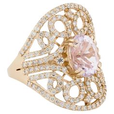 This 14K Yellow Gold cocktail ring is a striking piece, featuring an exquisite oval modified brilliant Kunzite as the centerpiece. The stunning pink hue of the Kunzite is beautifully complemented by four round modified brilliant sapphires and 166 round brilliant diamonds, adding a touch of sparkle and elegance. The ring’s bold design, with an ornament length of 21.5mm and a width of 20mm, makes it a perfect accessory for any special occasion. The band, measuring 6.6mm in width, offers a comfortable fit. While the ring is unmarked, it has been tested and confirmed for 14K purity. This unique piece is ideal for women who appreciate fine craftsmanship and luxurious gemstones. Specifications: * SKU: SXNR-602 * Stock ID: RRING279678 * Metal Type: 14K Yellow Gold * Total Item Weight: 4.5 grams * Yellow Gold Cocktail Ring, Sapphire Cocktail Ring, Diamond Cocktail Ring, Gold Cocktail Ring, Gold Cocktail, Diamond Cocktail Rings, Modern Ring, Sapphire Stone, Bold Design