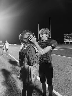 Football, girlfriend where’s helmet, and on the field after a game. Boyfriend Football Pictures, Pics With Football Boyfriend, Girlfriend Wearing Boyfriends Jersey, Boyfriend Girlfriend Football Pictures, Boyfriend And Girlfriend Football Pics, Cute Football Pictures With Boyfriend, Cute Bf And Gf Pics Football Players, Girlfriend Supporting Boyfriend Football, Girlfriend Picture Ideas