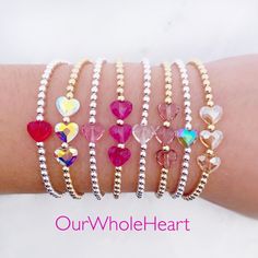 All of our bracelets are handmade in Hoboken, NJ, a little town which is near and dear to our hearts. This beautiful Swarovski heart bracelet is completely customizable - chose a single crystal heart or three. Also choose from 8 colors: red, fuchsia, rose, dusty lilac, mermaid, unicorn, clear, and silk. One inch of extra chain lets you adjust the bracelet to your preference. All items are hand-made in the USA in a smoke-free studio, and most importantly, they're made with OurWholeHeart❤︎ ------- Adjustable Heart Beads Crystal Bracelet Gift, Adjustable Crystal Bracelet With Heart Beads For Gift, Adjustable Heart-shaped Crystal Bracelet Gift, Hypoallergenic Heart-shaped Beaded Bracelets For Valentine's Day, Dainty Heart Beaded Bracelet For Friendship, Silver Beaded Crystal Bracelet For Valentine's Day, Valentine's Day Silver Beaded Crystal Bracelet, Dainty Heart Beaded Bracelets For Valentine's Day, Valentine's Day Adjustable Bracelets With Faceted Beads