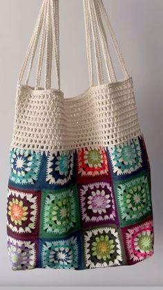 a crocheted bag hanging from a hook