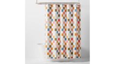 a shower curtain with colorful squares on it